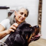 Healthy dog and cat enjoying premium pet nutrition at home.